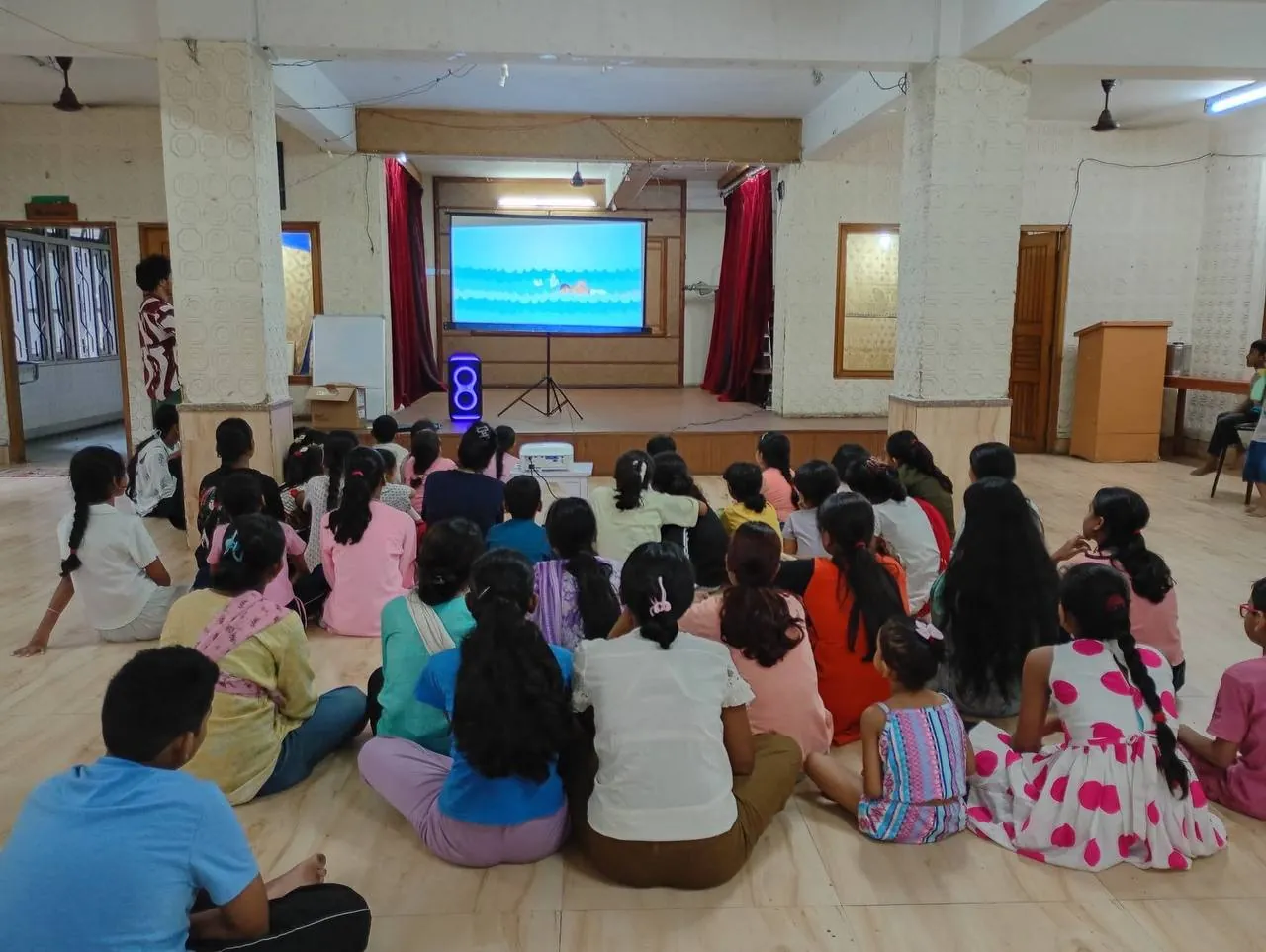 Children playing joyfully at NEET's Community Library