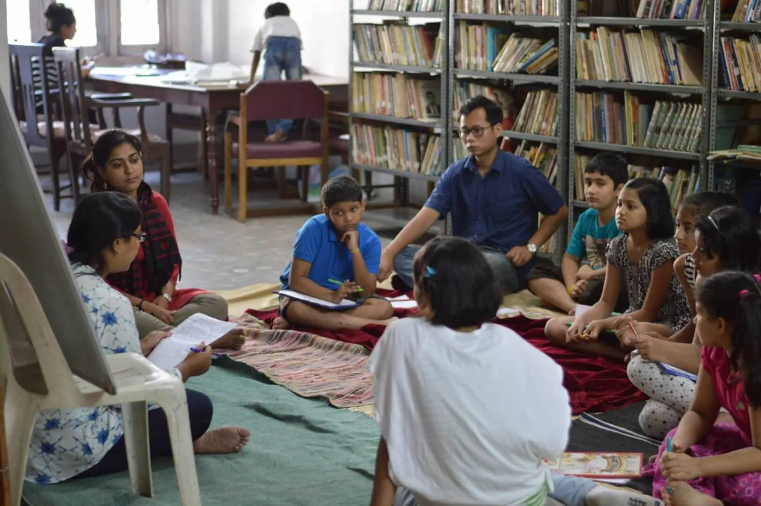Children reading books at NEET's Community Library