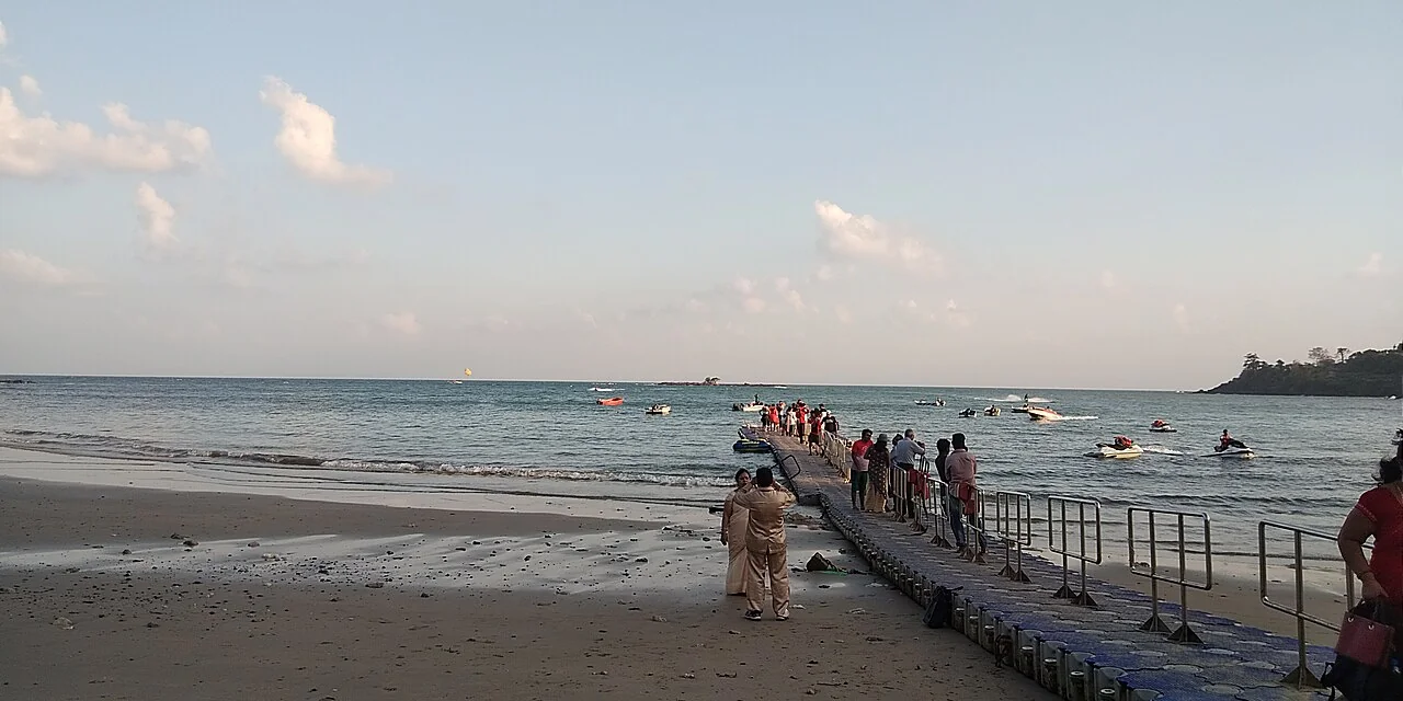 Coconut-fringed curve of Corbyns Cove Beach in Port Blair